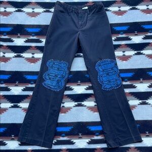 Upcycled dickies with block print hand stitched snakes